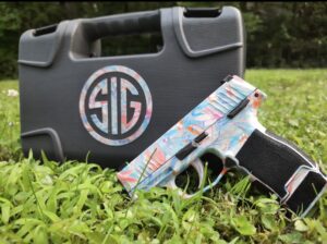 Left side view of the new and always available Floral Sign Sauer P365 with manual safety pistol with matching case