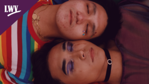 An LGBTIQA+ couple looking into one another's eyes