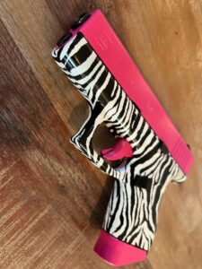 Pink guns - pink slide on zebra frame