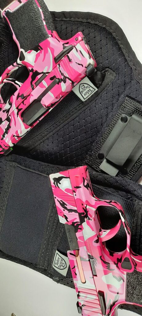 image of Two customized Pink guns in Pink Camo Sig Sauer P365 pistols featured in and around an IWB holster