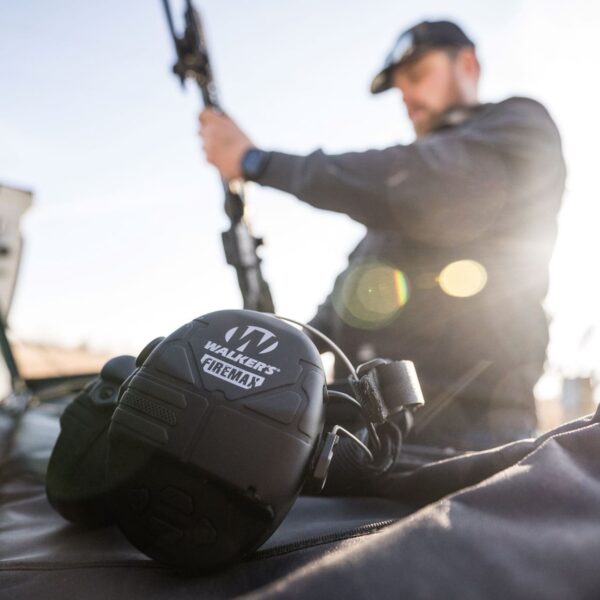 View of the Walker's walkie talkie FireMax headphones out in the field on the firing range