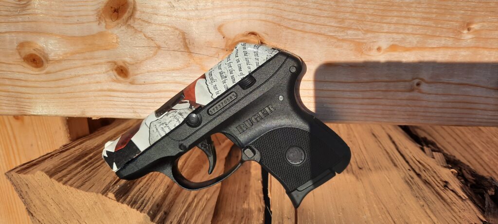 Ruger LCP .380 customized with the American Amendments that include the red, white, and blue colors along with American flag. No. 14 pistol added to the Pink Guns collection for retail sale in 2025